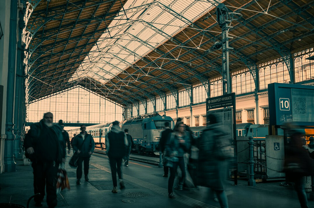 Commuters walking through a busy transit station