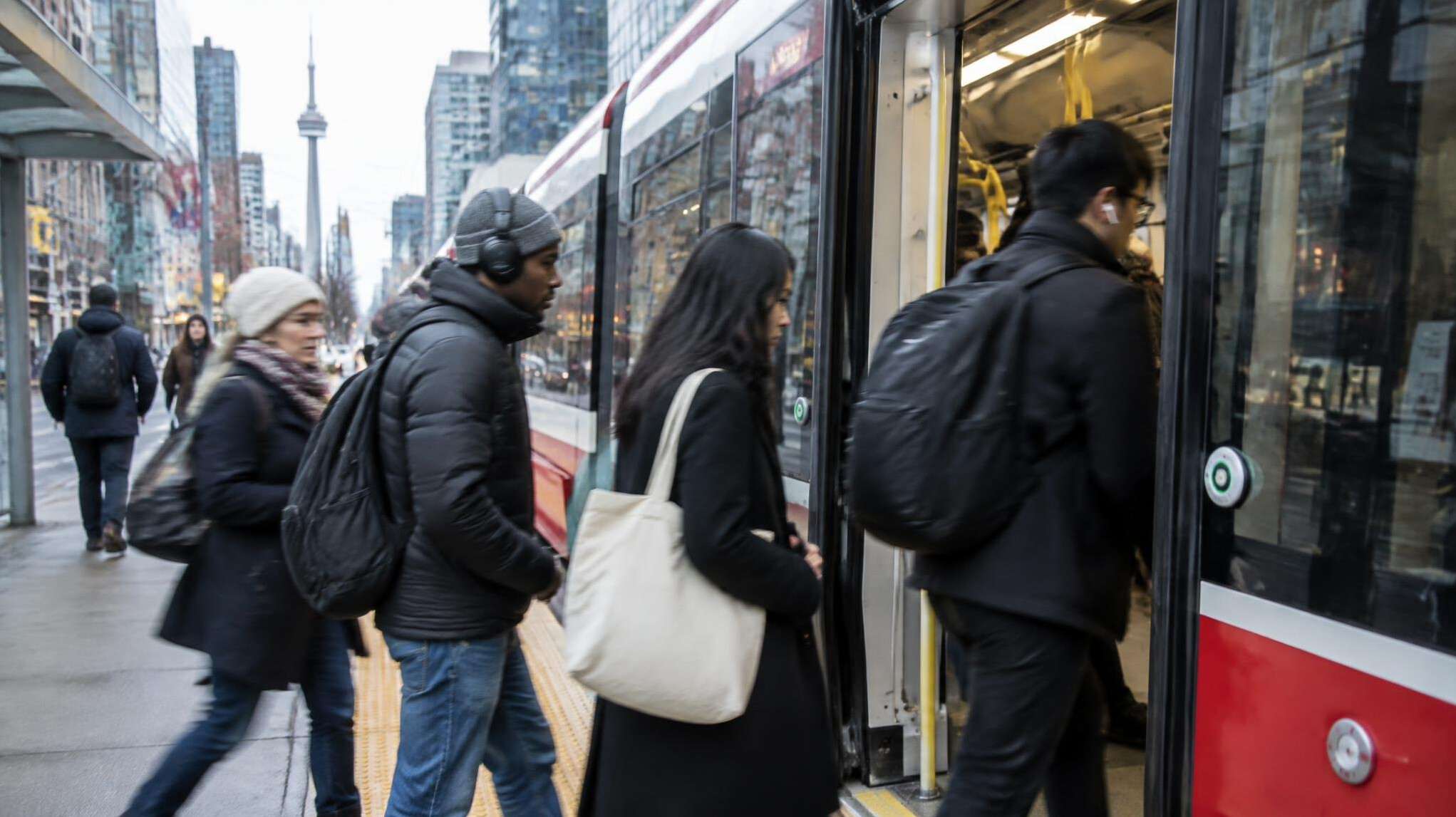 Passengers boarding a city streetcar